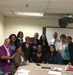 Educators gathered around a conference table