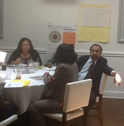 Administrators in a meeting around a table