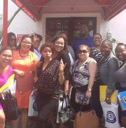 A group of District 9 staff outside a school entrance