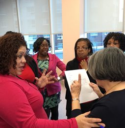 Educators reviewing papers together