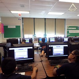 Students working at computers in a school computer lab